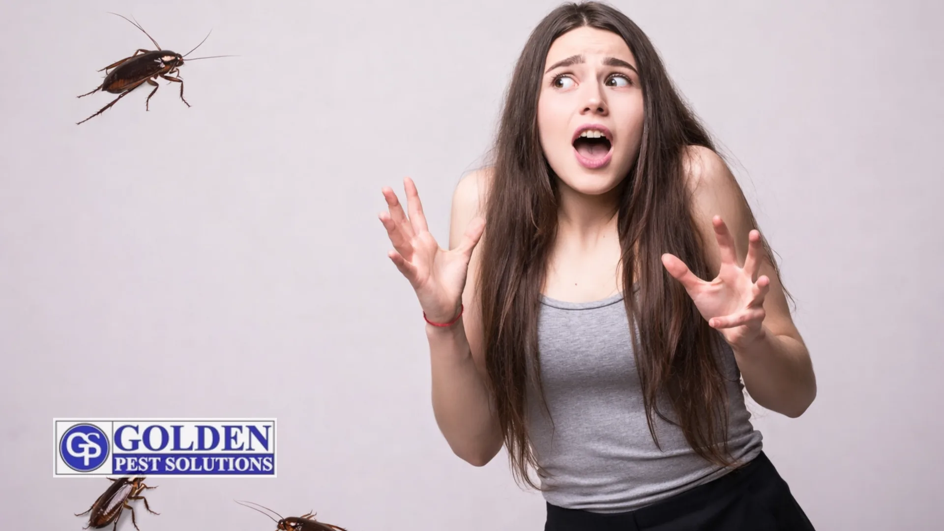 Frightened young woman recoiling with raised hands as cockroaches appear around her against a light background, with a pest control company logo visible. cockroach control by golden pest solutions