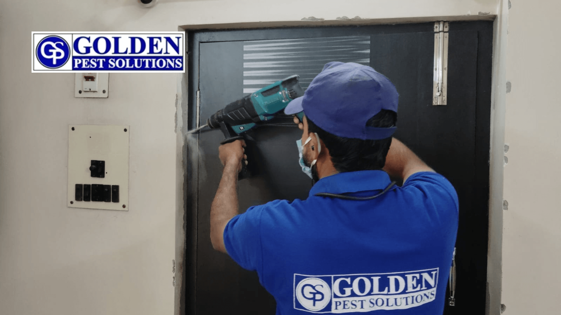 golden pest solutions pest control worker doing pest control