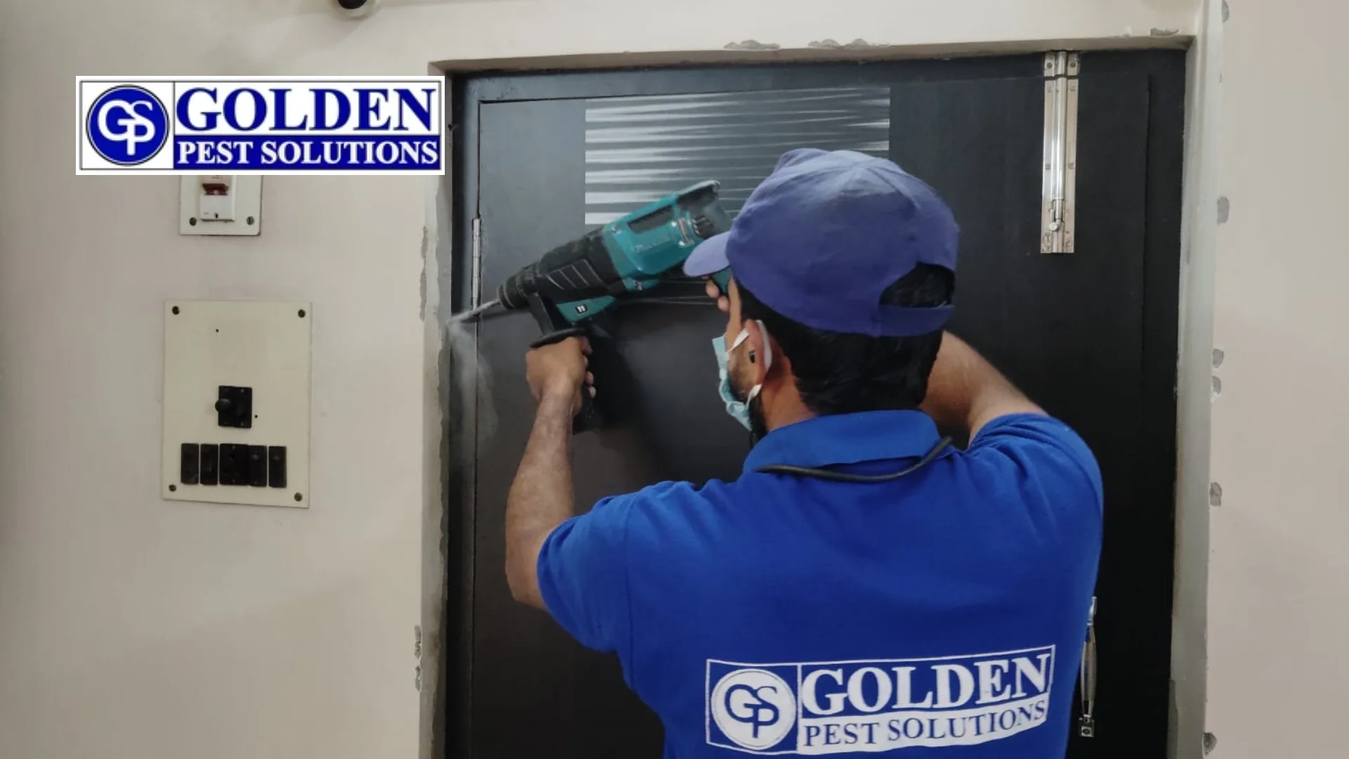 Golden Pest Solutions' pest control technician is doing pest control.